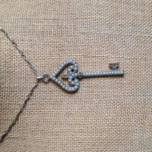 Silver toned key necklace